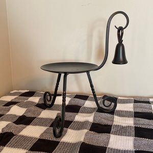 Black metal candle holder.